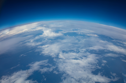 Earth from space, clouds and blue sky.
